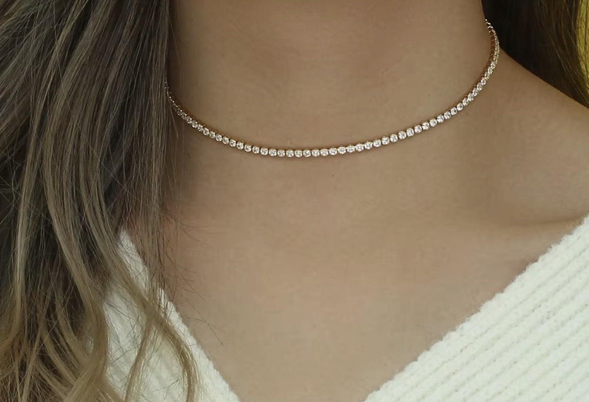 14K gold-plated rhinestone choker worn on the neck